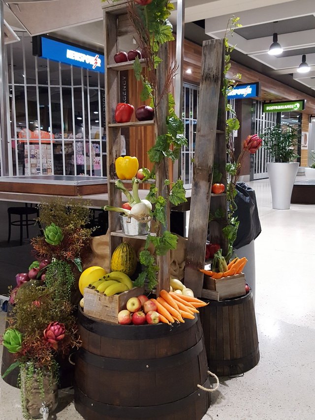 Freestanding Market Day barrels of fruit and vegies. Display by Silent Salesman, Melbourne.